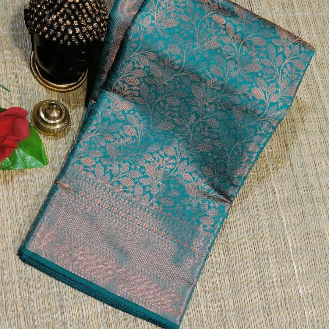 Sensational Rama Soft Banarasi Silk Saree With Gleaming Blouse Piece
